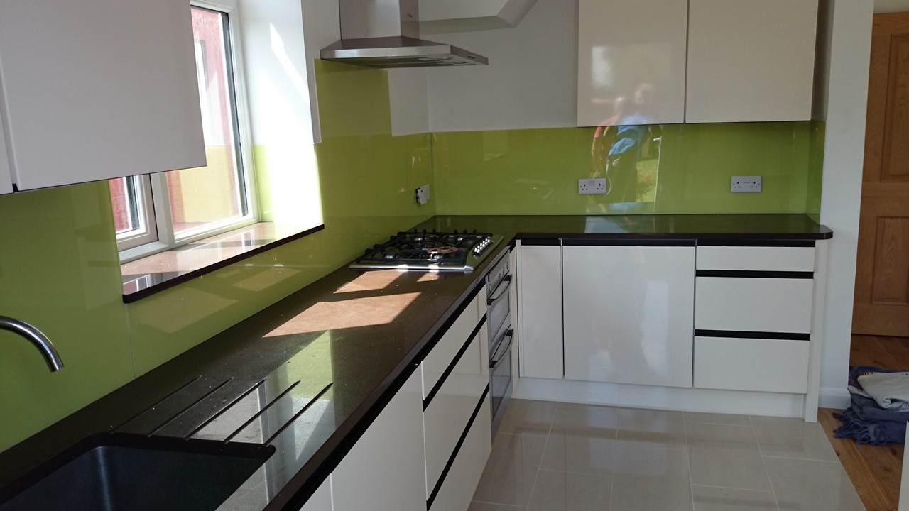 Lime green glass kitchen splashback installed by Penge glaziers