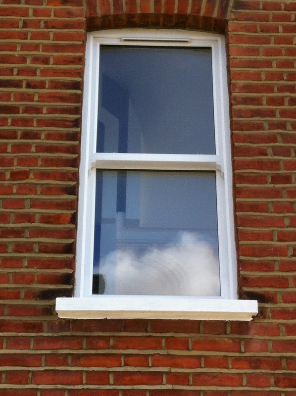 uPVC sash window on Victorian red brick house in Penge